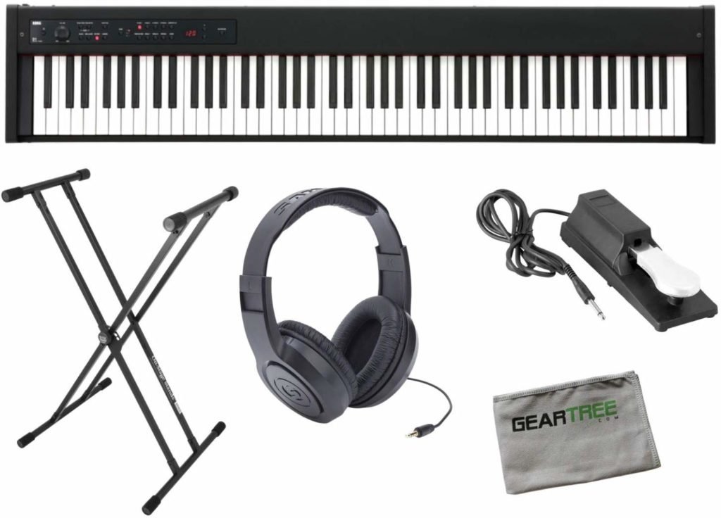 Black folding keyboard stand with over-ear headphones and a power adapter