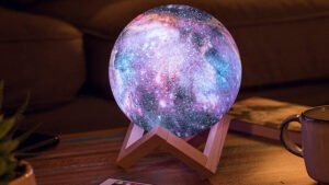 Galaxy pattern globe lamp on a wooden X-stand