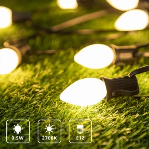 Warm white LED string bulbs with teardrop C9 shape on a dark wire