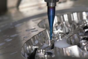 Machining bit cutting into a shiny metal component